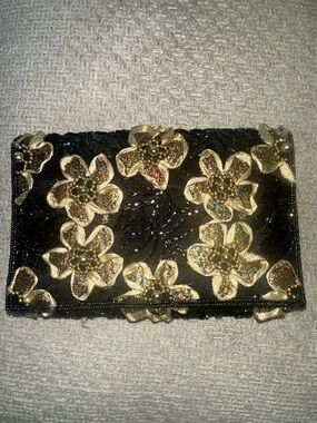 A Classy Chic Boutique Black Clutch with Gold Floral Appliqués